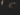 Man in a black hoodie in the dark
